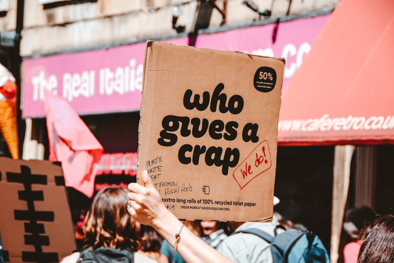 Hamster Signs - person holding Who Give A crap decor