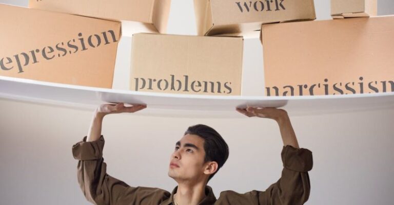 Hamster Issues - Man Standing with Arms Raised and Holding Boxes with Problems