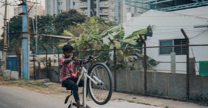 Hamster Tricks - Boy Performing Tricks on Bicycle